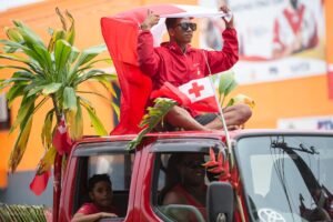 Buy holding Tongan flag 