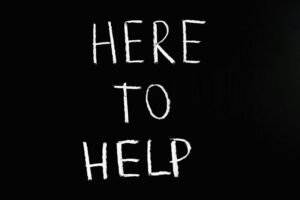 Sign that says Here to Help 